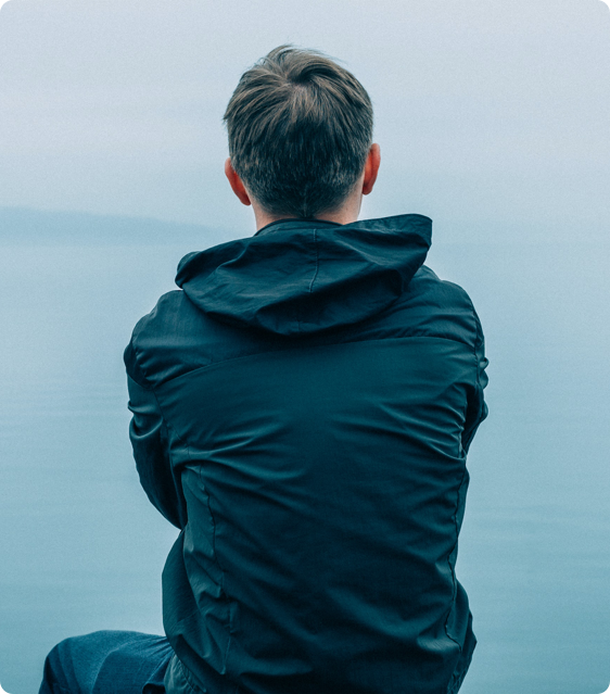 man looking at sea