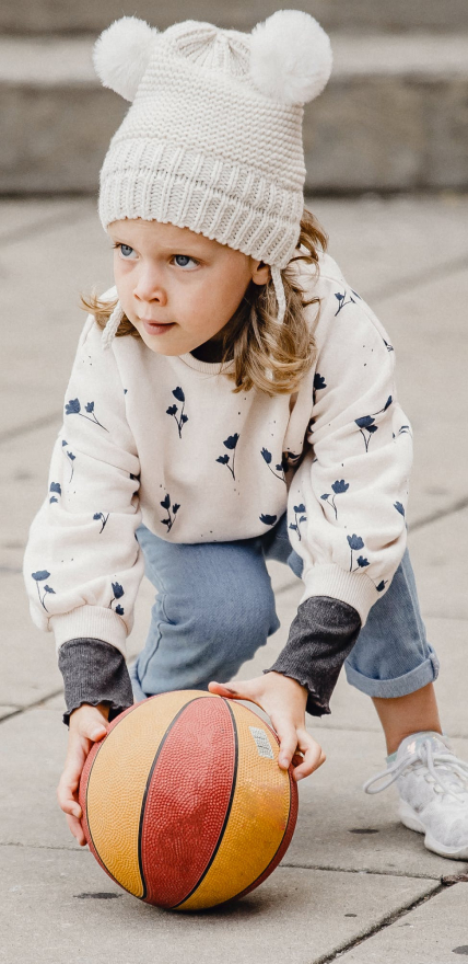 girl holds ball