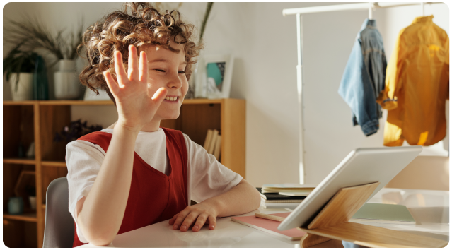 Image Of Student Waving to Ipad