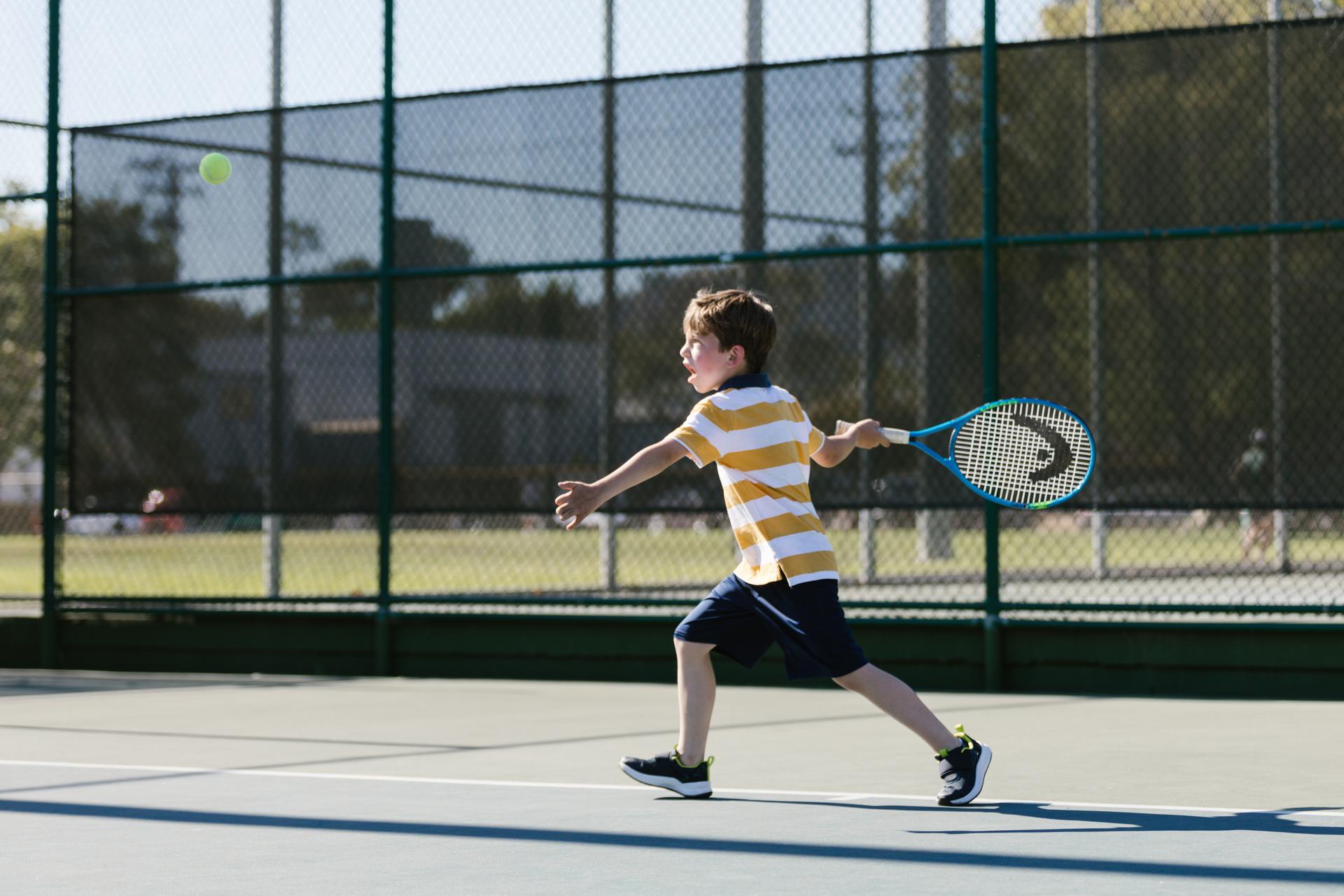 Boy playing tennis